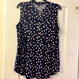 Sleeveless navy polka dot blouse